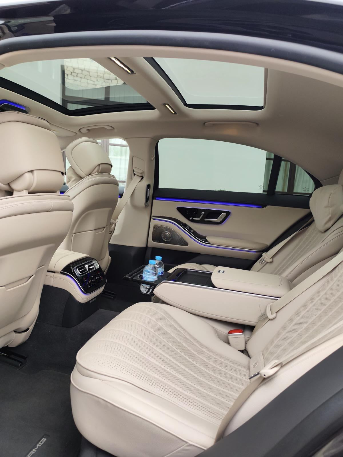 Spacious cream leather rear seats of the Mercedes S-Class with panoramic roof